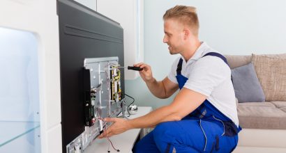 Electrician Repairing Television
